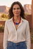 Brunette model wearing the Alhambra Necklace in a Southwestern editorial portrait